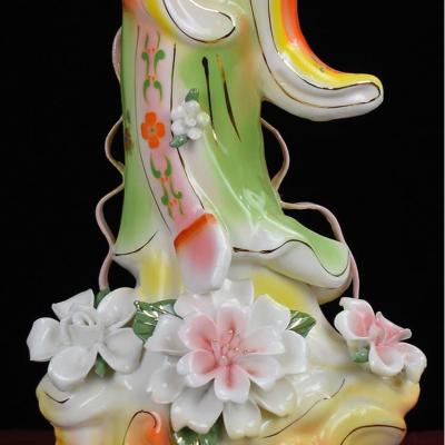 TƯỢNG SỨ CÔ TIÊN CẦM NHÀNH HOA